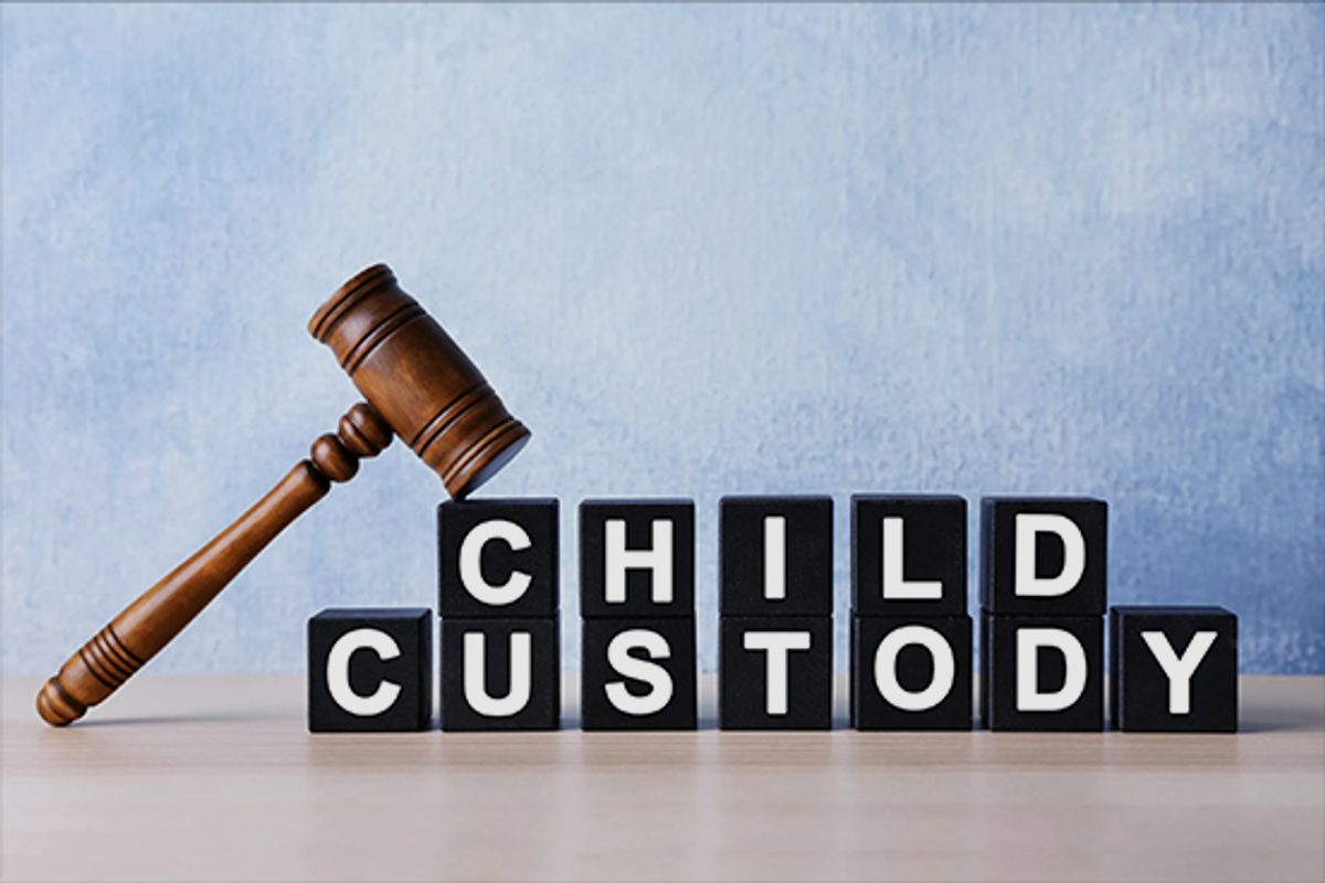 Child custody spelled in letter blocks beside a gavel